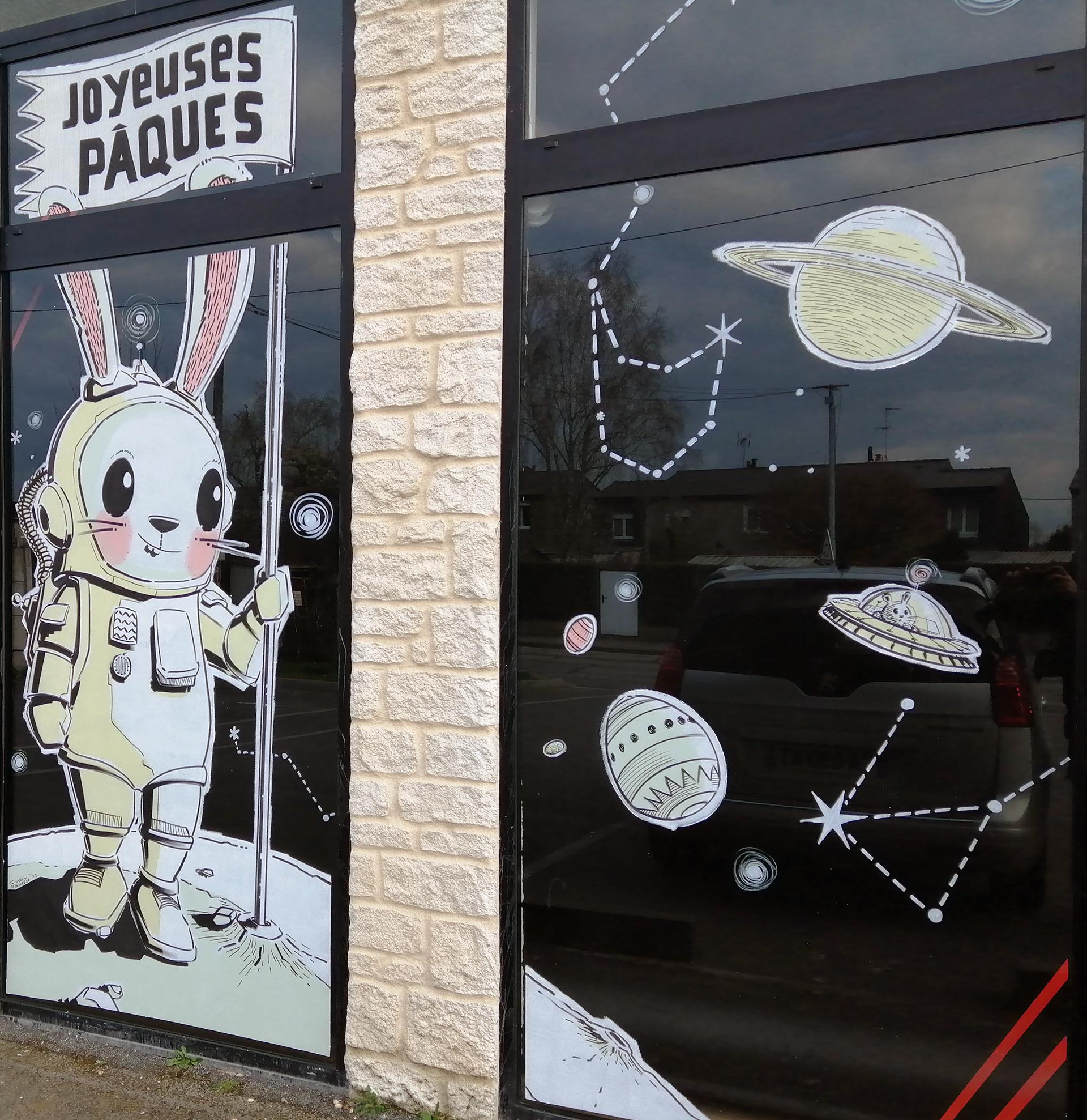 Vitrine de Pâques cosmique avec lapin astronaute et décor spatial