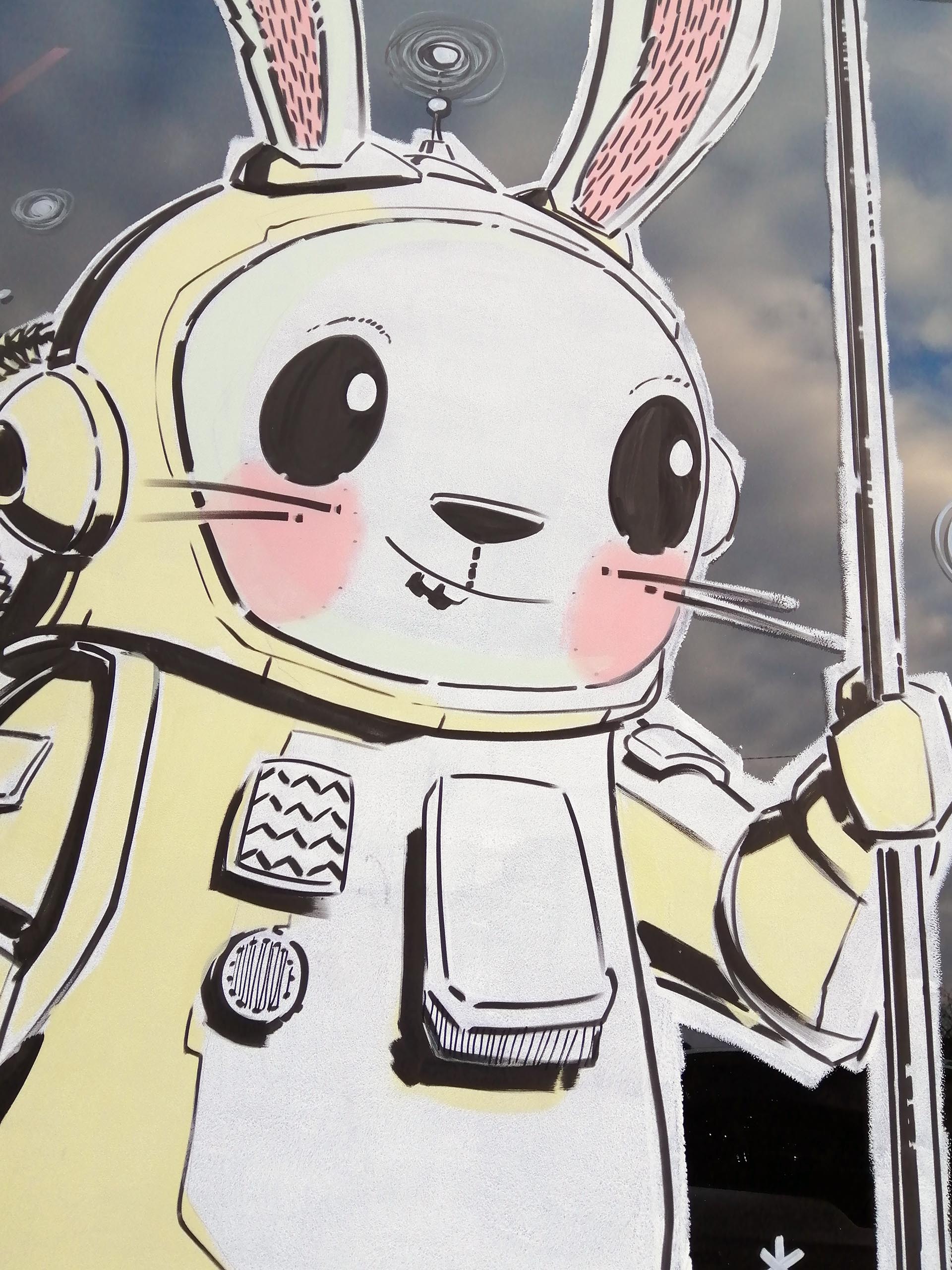 Vitrine de Pâques cosmique avec lapin astronaute et décor spatial